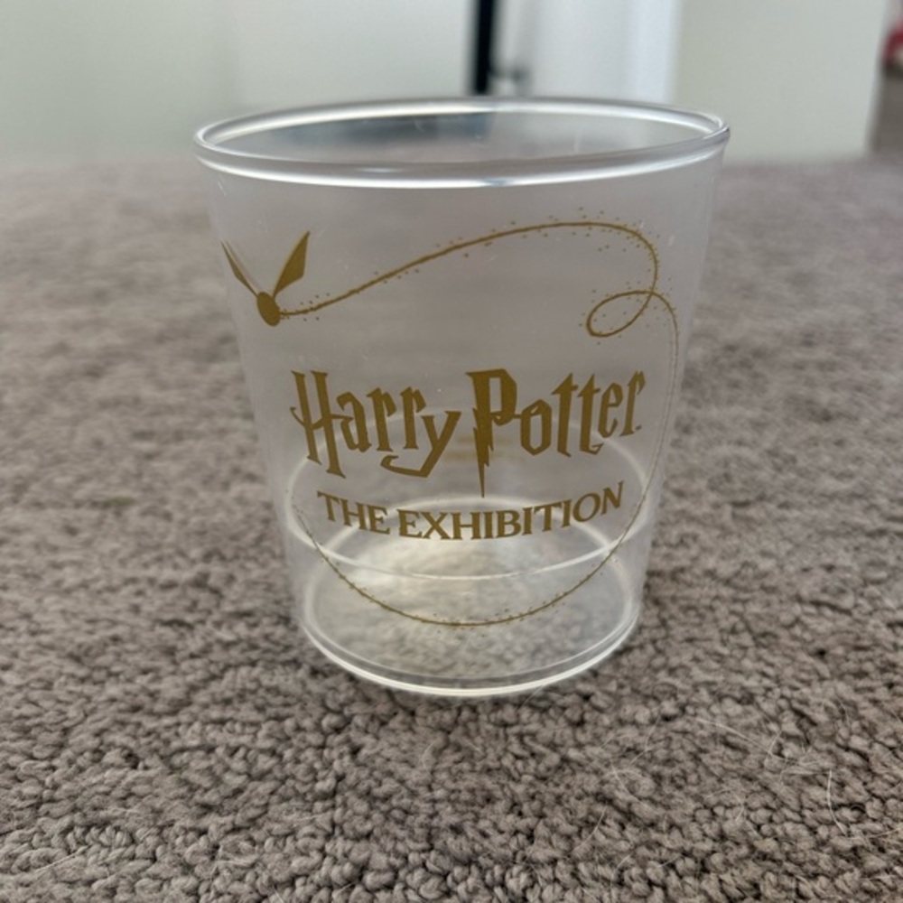 Harry Potter The Exhibition Clear and Gold Plastic Party Cup NWOT